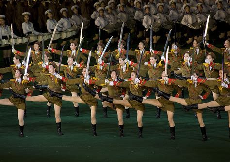 Sexy North Korean Women Dressed As Soldiers Dancing With Swords During The Arirang Mass Games In