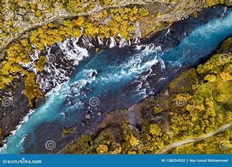 Aerial View Of Autumn Foliage At Hraunfossar Waterfalls In Husafell