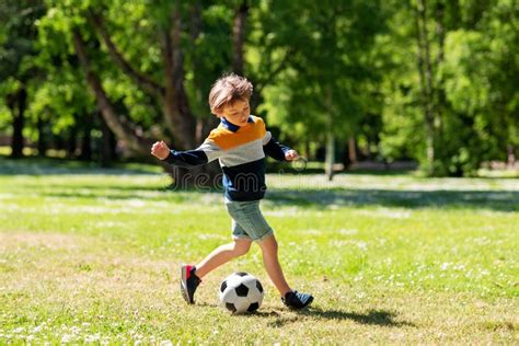 Happy Little Boy With Ball Playing Soccer At Park Stock Image Image