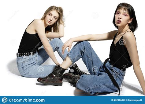 Youth Lifestyle Concepts Portrait Of Young Caucasian Lesbian Couple Posing Together In Front Of