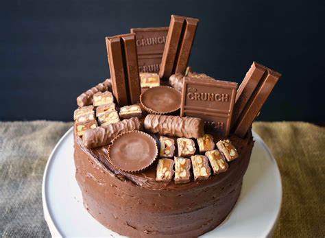 I add dried fruit for color accents. Candy Bar Stash Chocolate Cake - Modern Honey