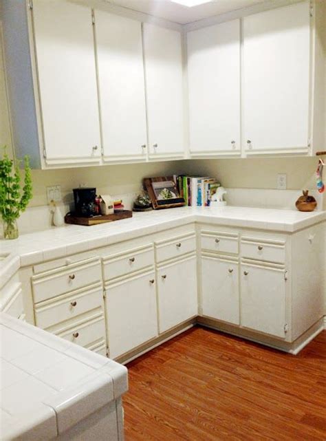 You may be able to sand the edges of the ripped area so it is a smooth transition as opposed to. Easy Kitchen Cabinet Makeover: paint laminate! | Painting ...