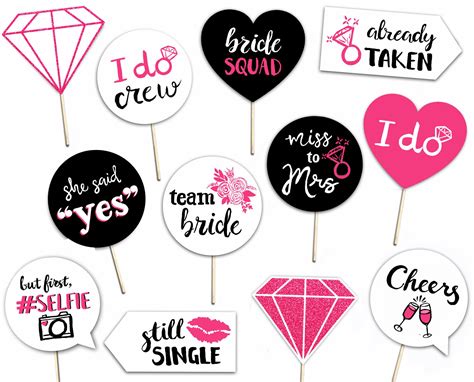 Bachelor Party Photo Booth Props With Pink Black And White Designs On Them For Bridal