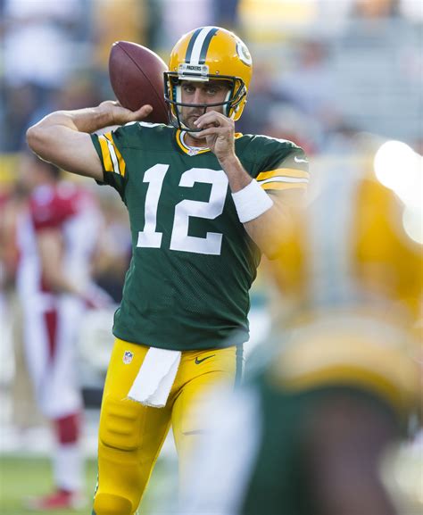 Green Bay Packers Quarterback Aaron Rodgers Throws A Pass During