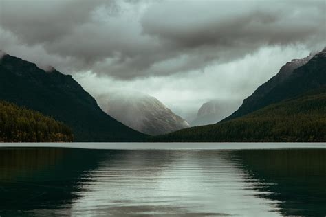 Body Of Water Surrounded With Mountains Photo Free Lake Image On Unsplash
