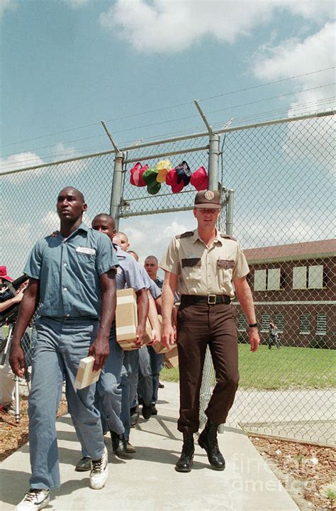 Prison Guard Walking With Inmates Photograph By Bettmann Pixels