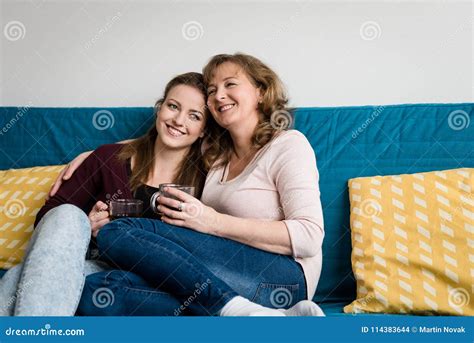 Affectionate Mother And Babe Sitting On Sofa At Home Stock Photo Image Of Relationship