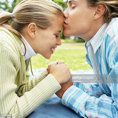 Couple Close Up Side View Blonde Kissing Holding Photos And Premium High Res Pictures Getty Images