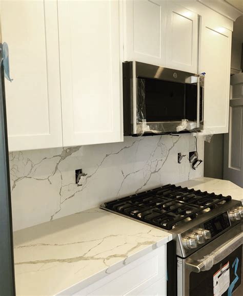 Its countertops does not take any credit for the photos on the particular post. White shaker cabinetry with quartz full height backsplash ...