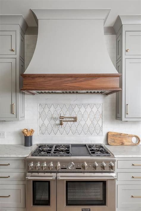 With a classic shape, solid wood trim, and customization possibilities, the vermont series is the ideal finishing touch for a variety. Light gray French hood with an oak trim in a transitional ...