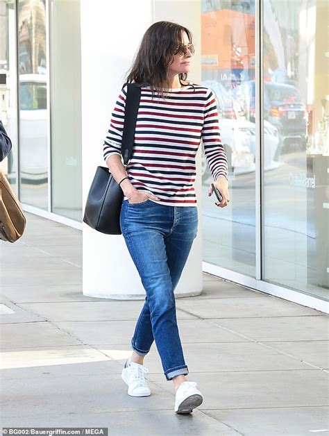 Courteney Cox 55 Looks Youthful In Tinted Sunglasses As She Texts