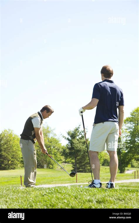 Golfers Practicing On Putting Green Stock Photo Alamy