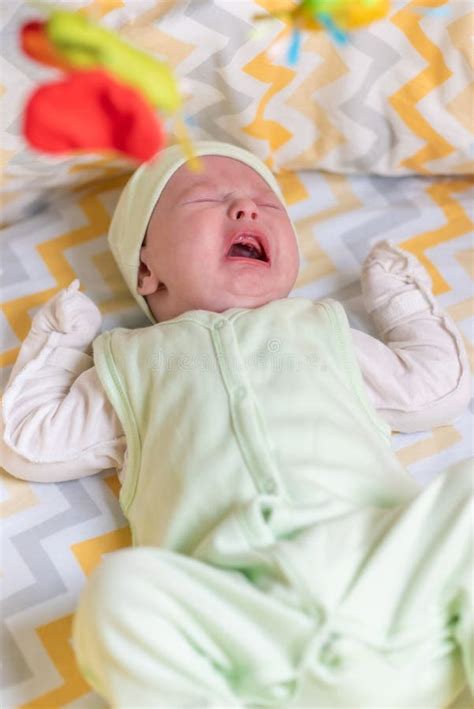 A Newborn Is Crying In The Crib Because Of Colic Stock Image Image Of