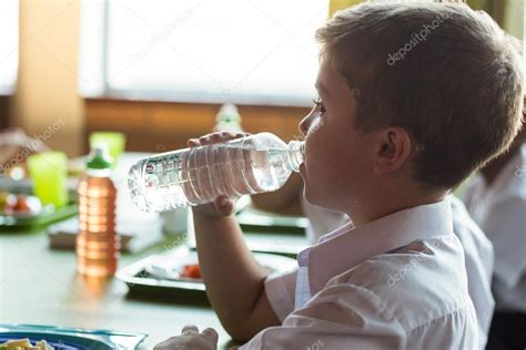 Schoolboy Drinking Water Stock Photo By ©wavebreakmedia 114919508