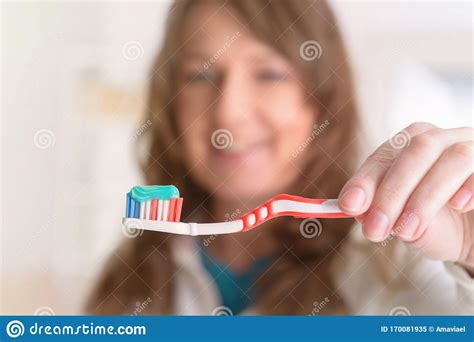 Smiling Woman Holding Toothbrush Stock Image Image Of Brushing Happy