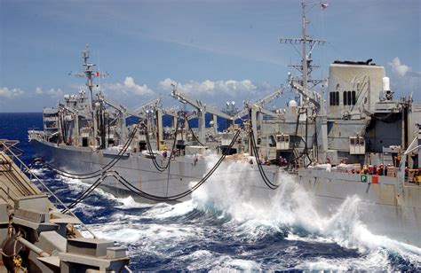 Waves Crash Between Ships As The Fast Combat Support Ship Uss ...