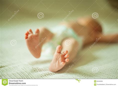 Health Concept Closeup Of Legs Of A Newborn Baby Lying Stock Image