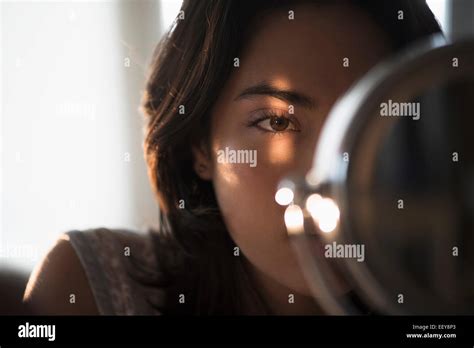 Young Woman Looking Mirror Hi Res Stock Photography And Images Alamy