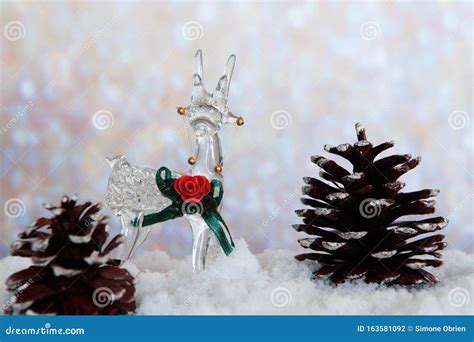 Glass Reindeer On Snow With Pine Cones Stock Photo Image Of Theme