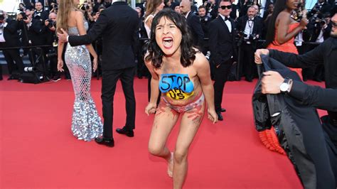 Cannes Film Festival Topless Screaming Protester Crashes Red Carpet
