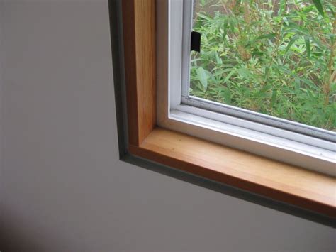 If your kitchen window is too wide or narrow to accommodate standard window treatment dimensions, consider customizing your own. minimal window trim for kitchen windows | Kitchen | Pinterest