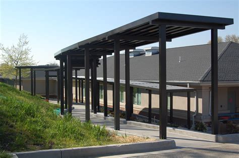 It can send a message of permanence. Extruded Aluminum Canopies - CSC Awnings Inc.