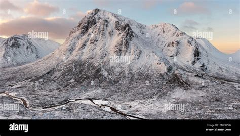 Dramatic Panoramic View Of Iconic Snow Covered Mountain Buachaille