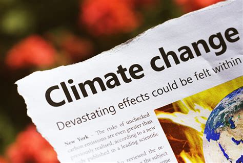 Newspaper Headline And Report Warn Of Worsening Climate Change As The