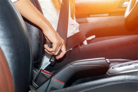 Premium Photo Asian Woman Fastening Seat Belt In The Car Safety Concept