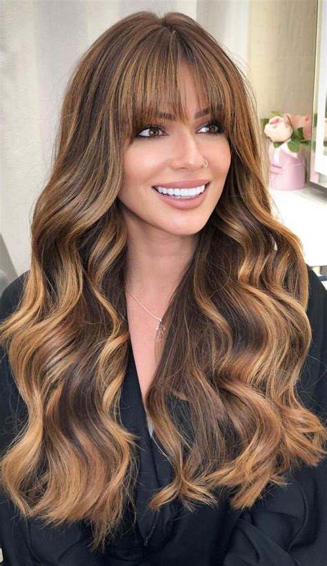 50 cute new hair color trends 2022 amber chestnut and honey fringe