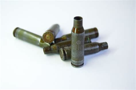Green Bullets From Kalashnikov Automatic Rifle At White Background