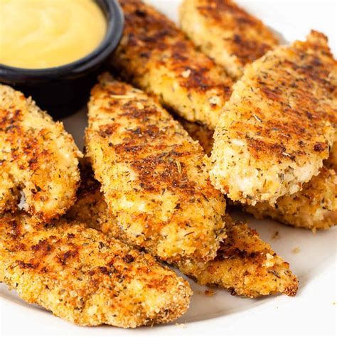 Andi is the author of the weary chef, an easy recipe blog focused on quick dinner recipes and other simple dishes for busy cooks. Oven Baked Chicken Tenders - Dishes With Dad