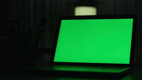 Laptop With Green Screen Dark Office Perfect To Put Your Own Image Or