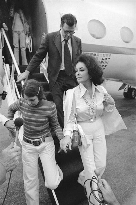 Actress Elizabeth Taylor Holds Hand Of Adopted Daughter Maria Upon Her Arrival In Evening On