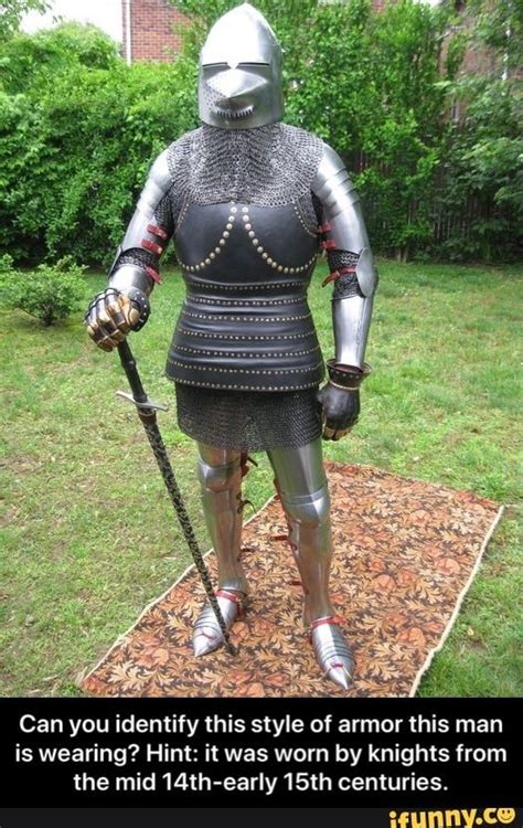 A Man In Armor Standing On Top Of A Rug