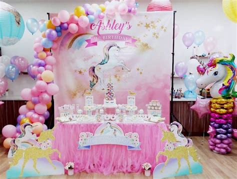 A Pink And Gold Birthday Party With Balloons Unicorns Cake And Other