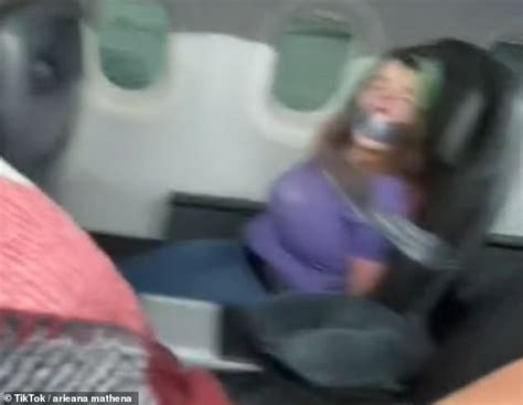 American Airlines Passenger Duct Taped To Seat After Trying Open Plane Door Biting Flight