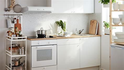 A Small White Kitchen Consisting Of A Built In Oven And Base 66d0f9eef26c29601a80bff227780ab2 