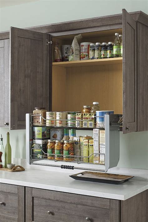 Customize your kitchen with specialty cabinet organizers to suit your installing a lazy susan in a corner cabinet puts everything within reach. Our two-tiered Pull Down Cabinet Shelf brings items in ...