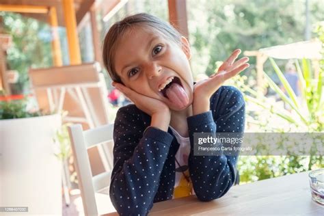 Girl Sticking Out Tongue Photo Getty Images