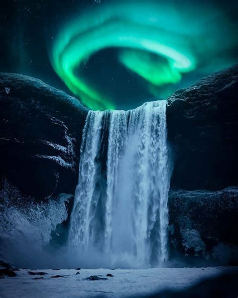 The Green Dance Above The Mighty Skógafoss Waterfall In Iceland By