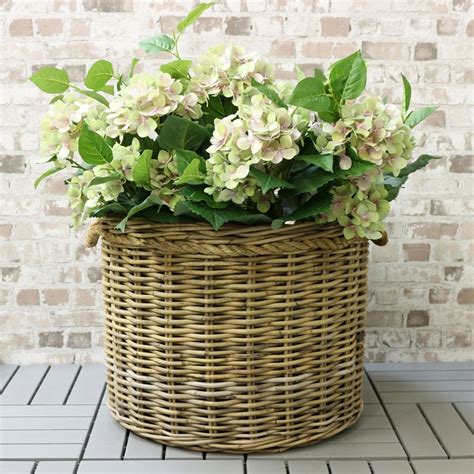 When overflowing with bright greenery or blooms, it can make even the drabbest entryway feel important. Grey & Buff Rattan Round Planter Rope Handles - The Basket ...