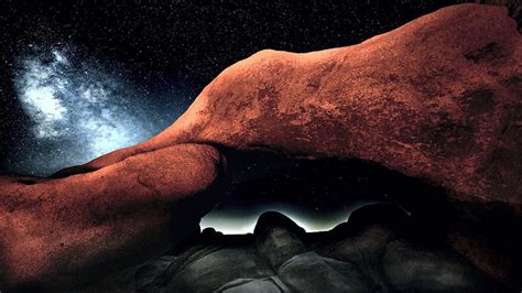 The Milky Way Behind Arch Rock In Joshua Tree California Night Stars