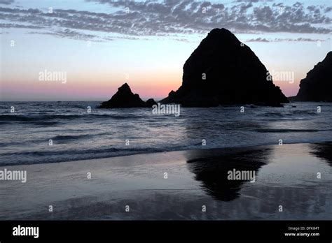 Whaleshead Rock Reflects In The Sands Of Whaleshead Beach In Southern