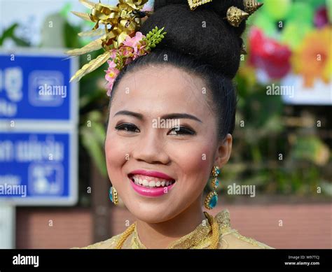 Dressed Up Thai Girl With Flowers In Her Hair Takes Part In The Village S Historical Lanna