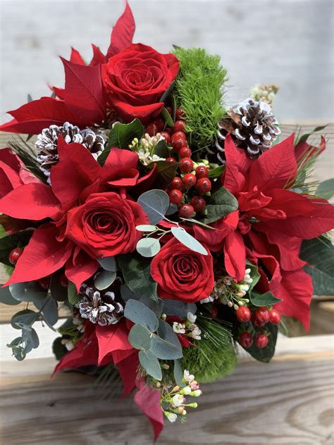 Winter Bouquet With Roses Pine Cones Hypericum Berries And