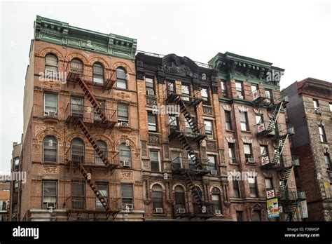 Typical New York City Apartment Building With Fire Escapes On The Lower