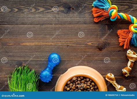 Dry Pet Dog Food In Bowl On Wooden Background Top View Mock Up Stock
