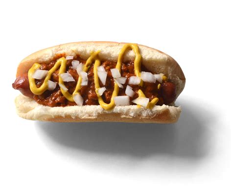We take franks and beans to another level with this spiced baked bean and gooey cheddar cheese topping. Coney Island Hot Dog chili beans grated cheese onions Nath ...