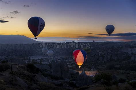 Hot Air Balloons Fly At Dawn Over The Hills Of Goreme Editorial Stock
